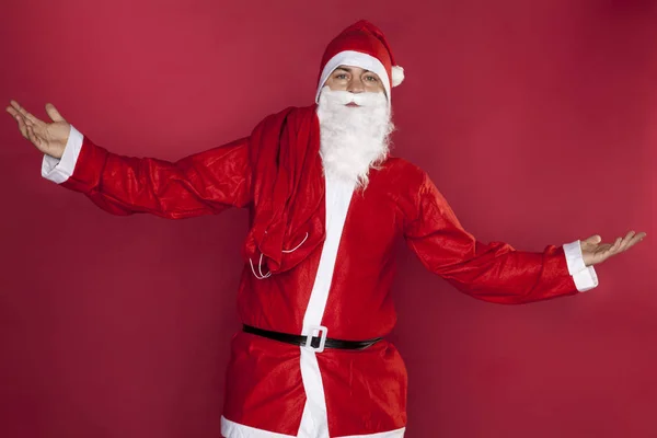 Santa Claus verspreidt zijn handen in hulpeloosheid — Stockfoto