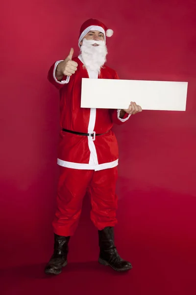 Happy santa clausule houdt een plek voor reclame, duim omhoog en c — Stockfoto