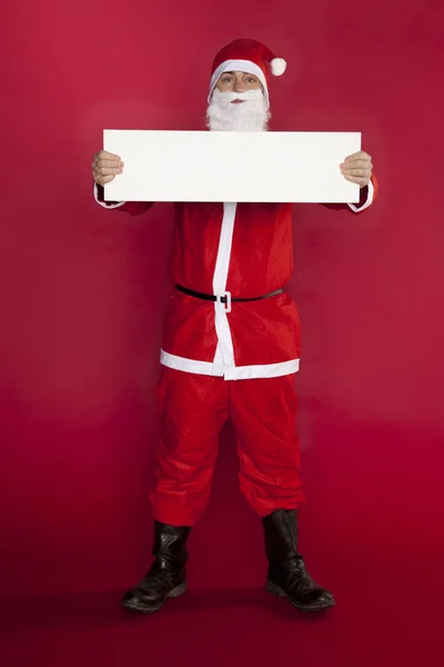 Santa Claus houdt een plaats voor reclame, onverschillige houding — Stockfoto