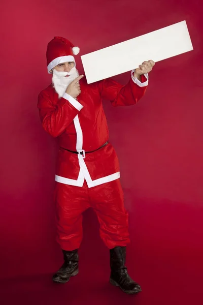 Gelukkig Kerstman houdt de plek voor de advertentie, hij wijst het erop — Stockfoto