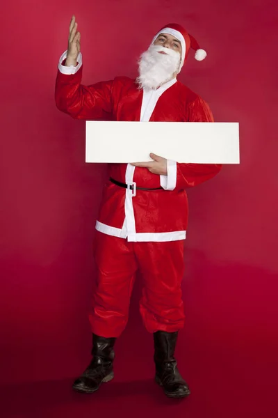 Verbaasd Santa Claus houdt een plaats voor reclame — Stockfoto