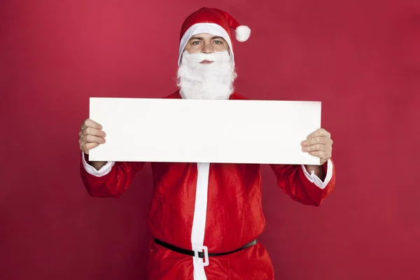 Santa Claus is holding an advertisement in front of him, — Stock Photo, Image