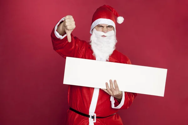 Santa Claus shows thumbs down — Stock Photo, Image