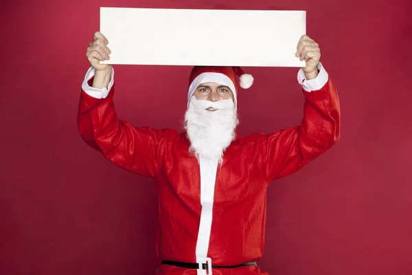 Santa claus keeps the place for the ad — Stock Photo, Image