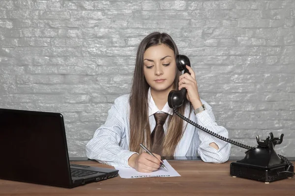 Telephone conversation and signing documents at the same time by — Stock Photo, Image