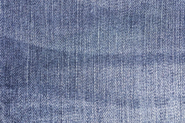 Niebieskiej tkaniny z dżinsami, zbliżenie na przejścia między kolorami — Zdjęcie stockowe