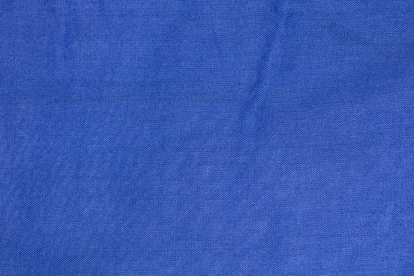 Kain biru dengan lipatan, penutupan, latar belakang — Stok Foto