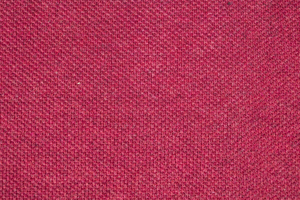 red fabric, closeup on stitch