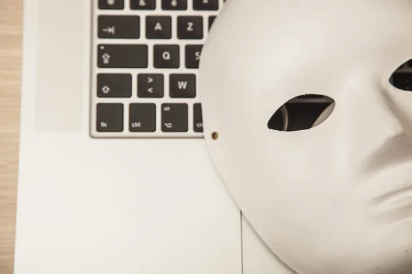 Conceptual photo, mask on a laptop as a symbol of a hacker attac — Stock Photo, Image