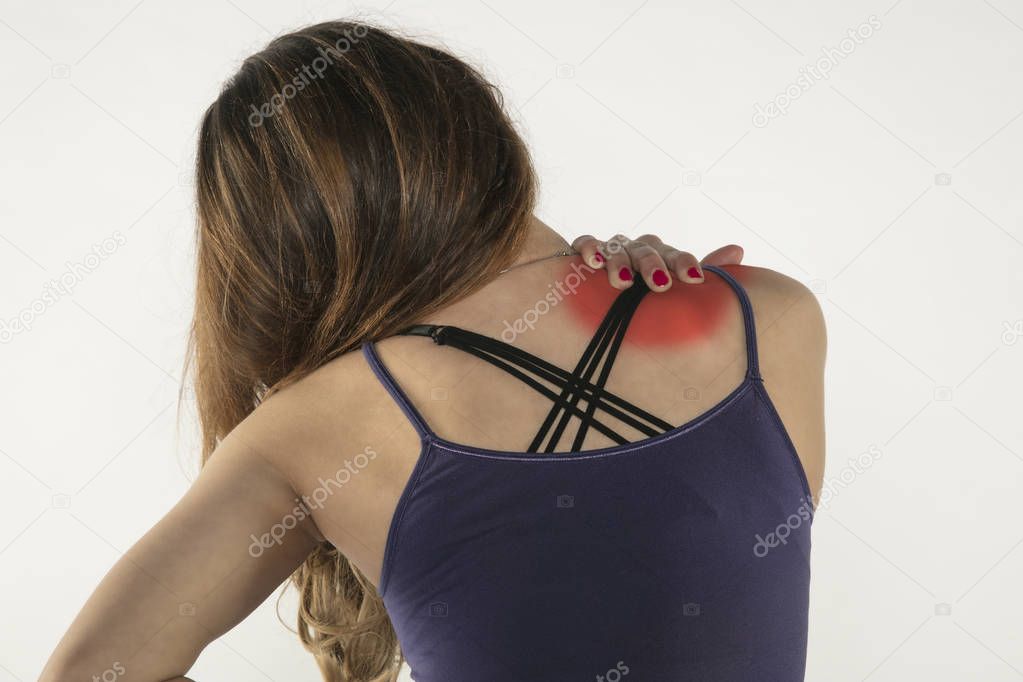 A young woman is struggling with pain, isolated on background