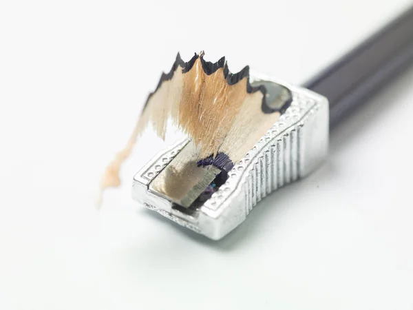 Colored pencil in sharpener, white background and copy space — Stock Photo, Image