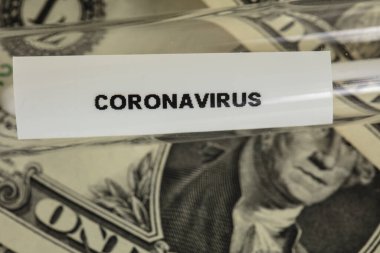 Coronavirus testleri bir dolarlık banknotta, salgının sembolü ve bununla ilgili maliyetler üzerine kuruludur.