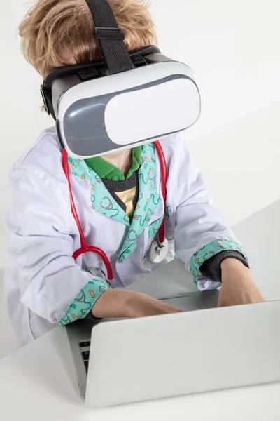 young doctor in virtual reality goggles is working on a 3D model of the virus