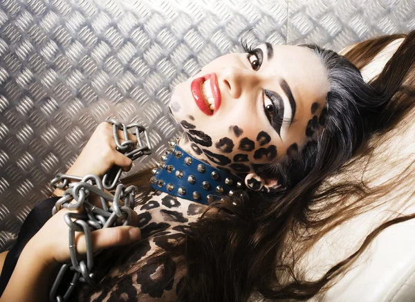 young sexy woman with leopard make up
