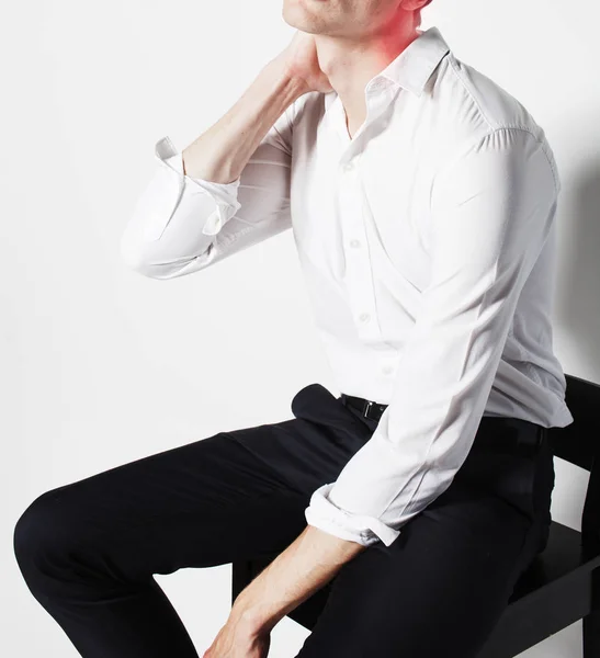 Businessman holding neck — Stock Image Businessman holding neck Royalty Free Stock Images