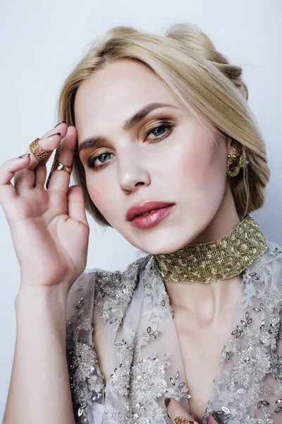 blond woman in luxury jewelry