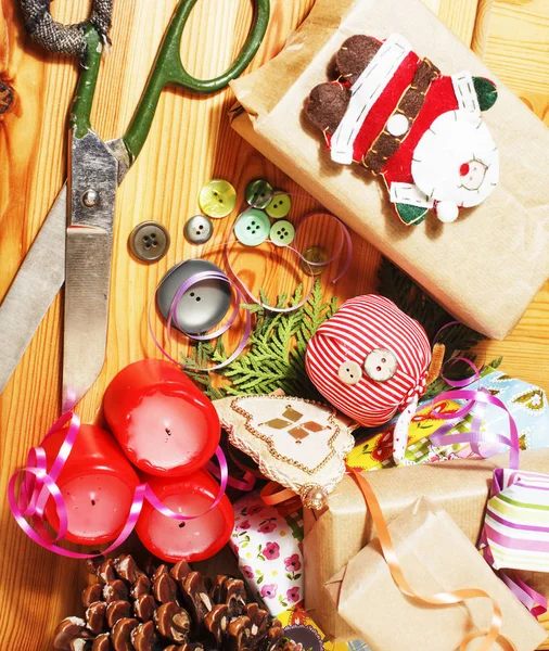 lot of stuff for handmade gifts, scissors, ribbon, paper with countryside pattern, ready for holiday concept, nobody home