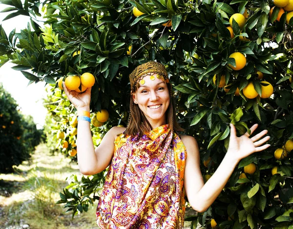pretty islam woman in orange grove