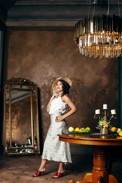 young pretty rich italian woman in golden luxury room interior, elegant styled hotel, people on vacation