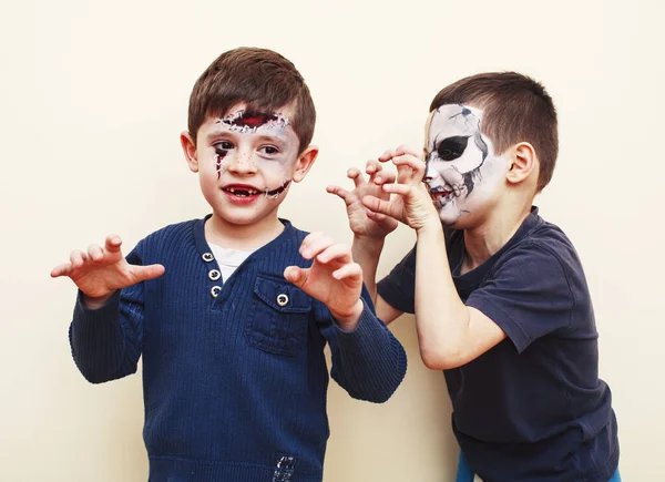 zombie apocalypse kids concept. Birthday party celebration facepaint on children dead bride, scar face, zombie skeleton together closeup makeup emotional posing.