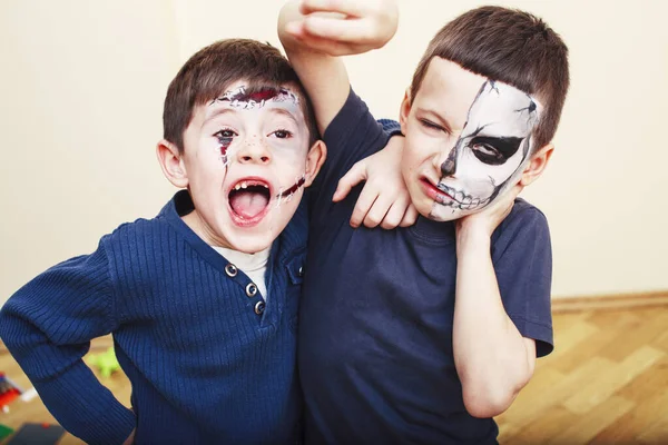 zombie apocalypse kids concept. Birthday party celebration facepaint on children dead bride, scar face, zombie skeleton together closeup makeup emotional posing.