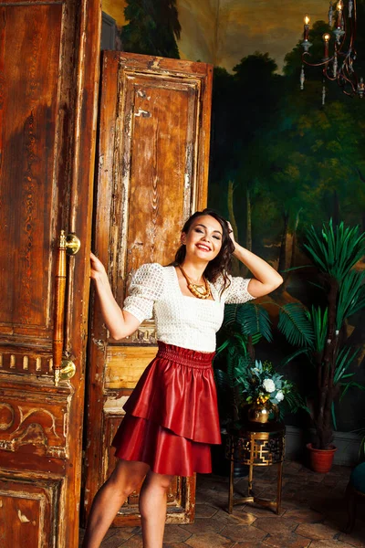 young pretty rich italian woman in golden luxury room interior, elegant styled hotel, people on vacation