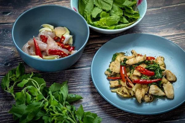 stock image Traditional Thai flavor food.Pad ka prao is a famous food of Thailand people.Spicy sweet basil leaf with garlic chilly and meat stir in the cuisine.