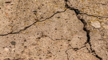 Çatlak beton dokusu yakın çekim. Soyut çimento arkaplanı