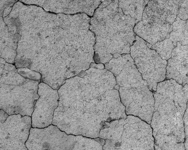 Yüksek çözünürlüklü eski beton çatlaklara ve zaman ve hava koşullarından kaynaklanan doğal yıkıma sahip. Renksiz, tek renkli, siyah beyaz fotoğraf.