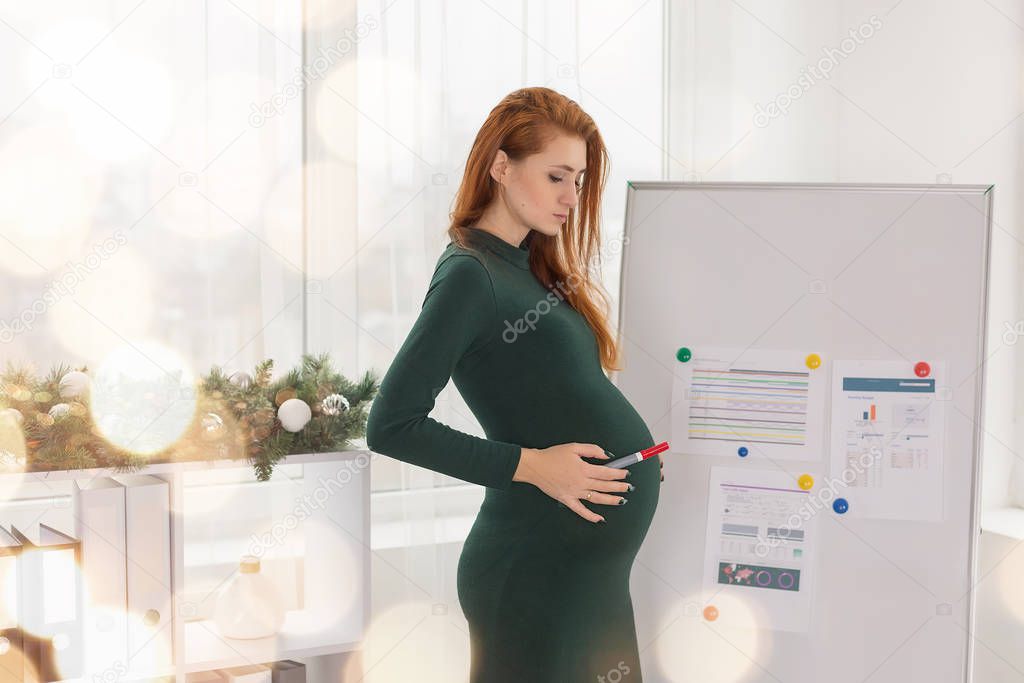 pregnant girl at work in the office