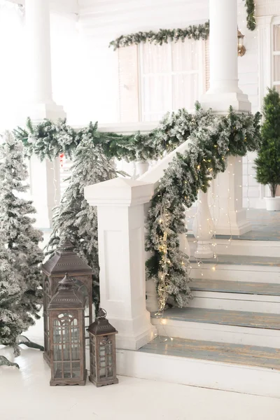 Christmas lanterns at the stairs of the house.