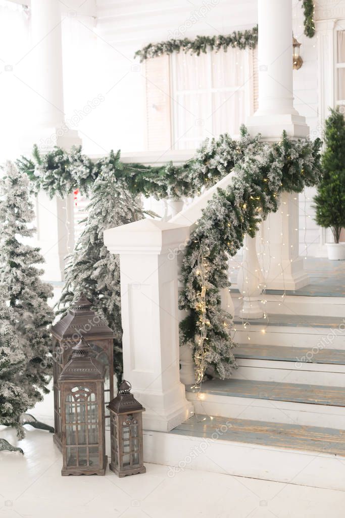 Christmas lanterns at the stairs of the house.