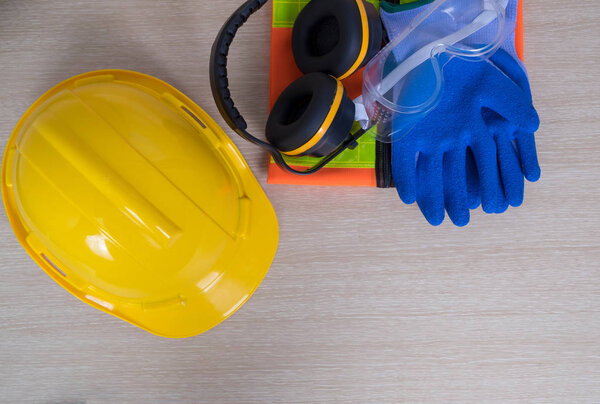 Standard construction safety on wooden background