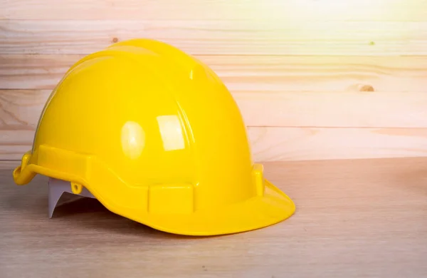 Close up safety helmet on wooden background