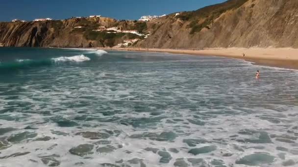 Aerial Drone Shot People Swimming Whitewater Waves Rolling Beach Next — Stock Video