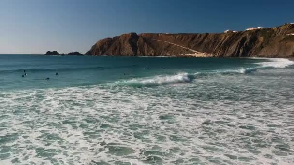 Aerial Drone Shot Surfers Lying Water Catching Waves Rolling Beach — Stock Video