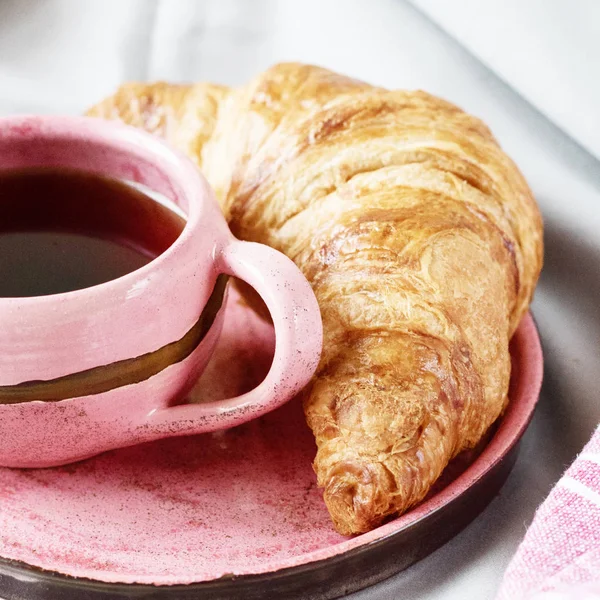 Black Coffee Ceramic Cup Crispy Croissant Pink Saucer Breakfast — Stock Photo, Image