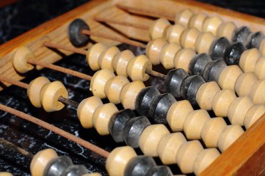 wooden abacus with knuckles, made in the USSR. An old device for simple mathematical calculations, used for accounting. Museum exhibit.