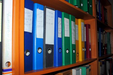 archive, shelf of documents and colored folders