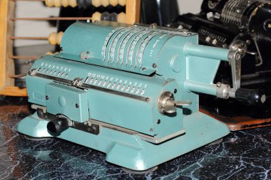 Counting machine Iron Felix. An ancient mechanical device for mathematical calculations. It was used for accounting. Museum exhibit, made in the USSR.