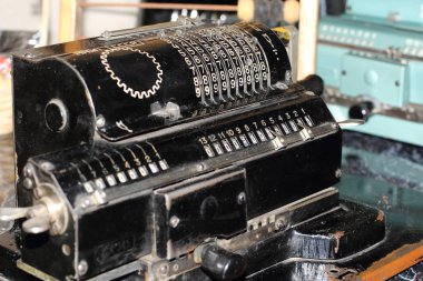Counting machine Iron Felix. An ancient mechanical device for mathematical calculations. It was used for accounting. Museum exhibit, made in the USSR.