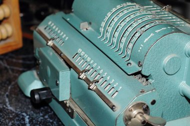 Counting machine Iron Felix. An ancient mechanical device for mathematical calculations. It was used for accounting. Museum exhibit, made in the USSR.