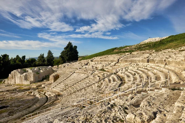 The Greek theatre of Syracuse Sicily Italy lies on the south slopes of the Temenite hill, overlooking the modern city of Syracuse in southeastern Sicily. It was first built in the 5th century BC, rebuilt in the 3rd century BC and renovated again