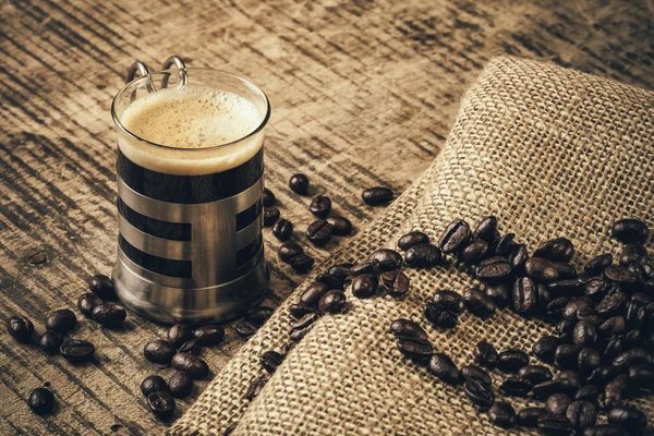 Espresso coffee on an old wooden table