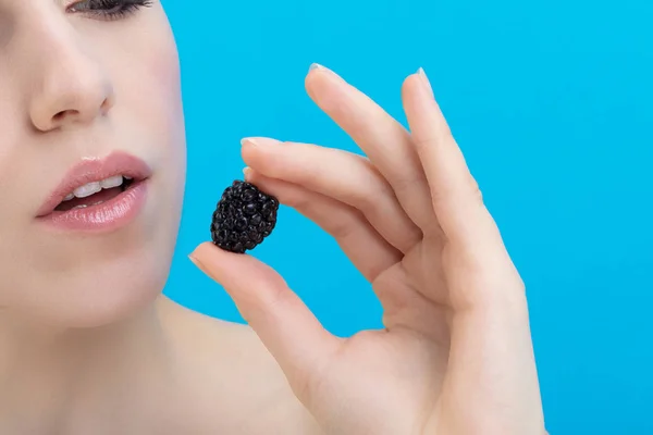 Portrait Young Woman Holding Blackberry Her Hand Stock Photo