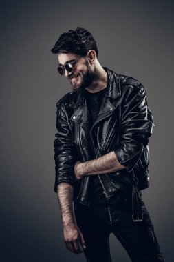 Young Hipster in Leather Jacket, Thinking, Head Tilted Down clipart