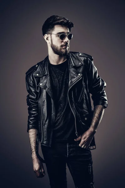 Young Hipster in Leather Jacket, Looks to the Side
