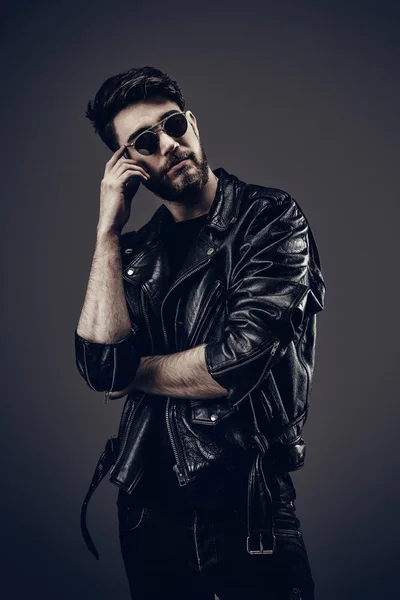 Young Hipster in Leather Jacket, Thinking, Head Tilted Down