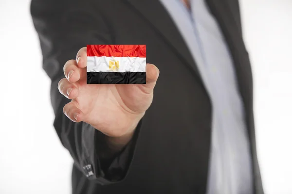 Businessman holding business card with Egypt flag — Stock Photo, Image