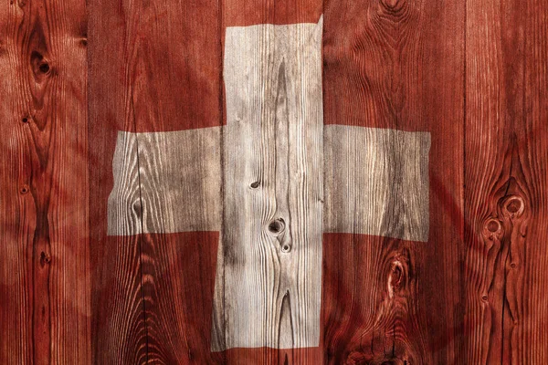 Nationalflagge der Schweiz, Hintergrund aus Holz — Stockfoto